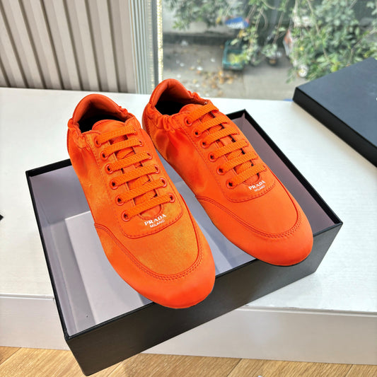 Prada 25s Sneaker In Orange Silk